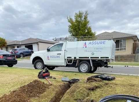 Assure Fix truck standing next to a tube dig