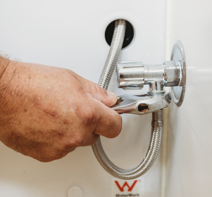 assure plumber installing appliance