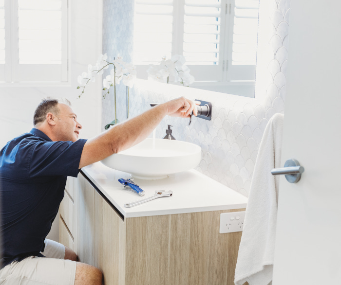 assure plumber renovating bathoom