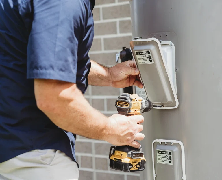 Assure Fix Plumbing Professional servicing hot water system getting and getting it fixed