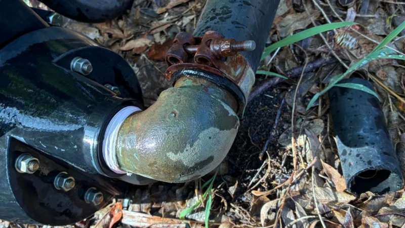 Leaking outdoor plumbing pipe connection during home plumbing inspection checklist